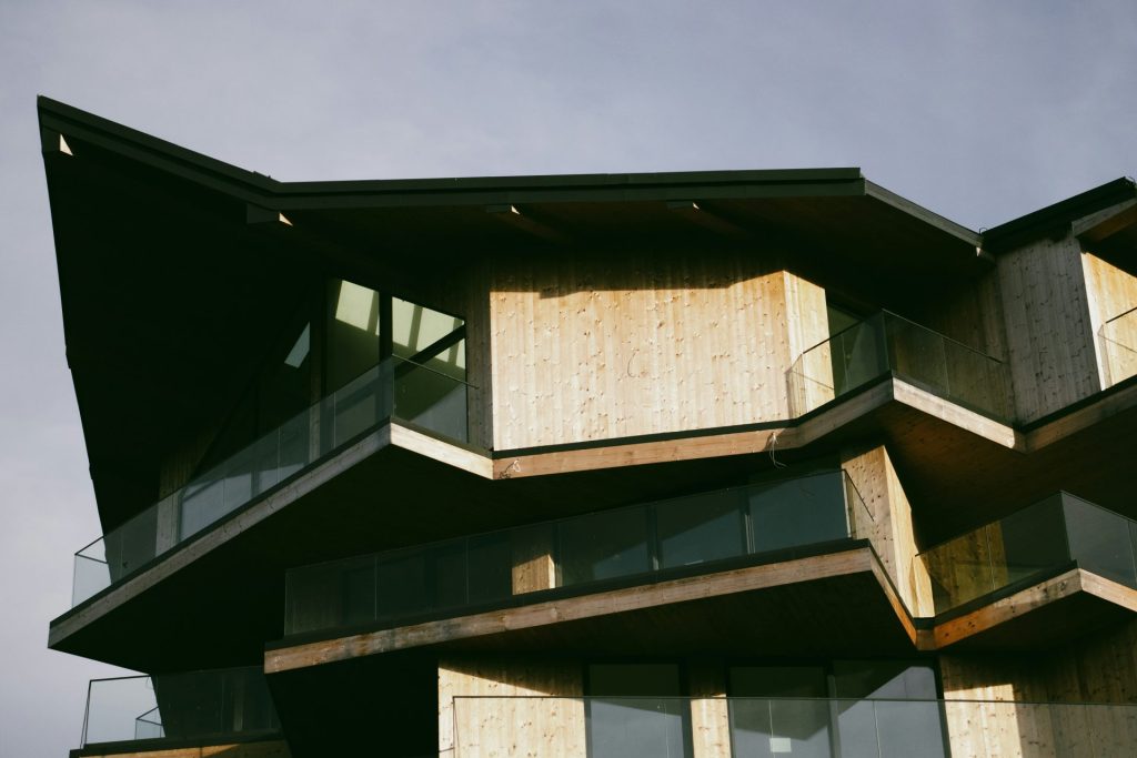 a tall building with lots of windows and balconies